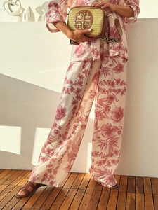 Close-up of vintage floral print on casual linen vacation two-piece set for women
