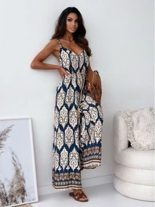 Detail of bohemian paisley print jumpsuit with V-neck and decorative brown waist belt