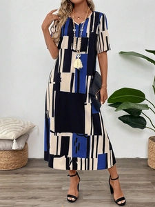 Detailed view of women's summer V-neck maxi dress with abstract geometric print fabric