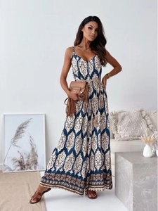Detail of bohemian deep blue paisley print on a wide-leg jumpsuit with V-neckline