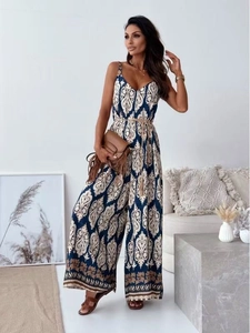 Detail of bohemian print V-neck jumpsuit with waist belt and wide-leg silhouette