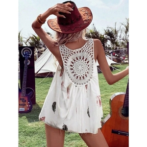 Detail of bohemian white V-neck top showing intricate crochet lace cutout on the back