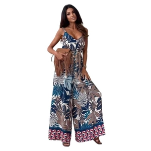 Women's V-neck wide leg jumpsuit with tropical leaf print and tassel belt detail