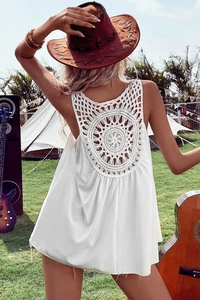 Detailed view of bohemian white tank top with intricate mandala crochet lace on the back