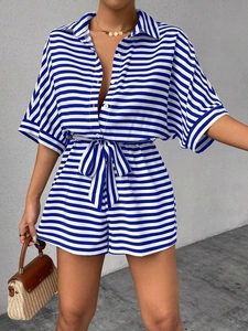 Blue and white striped summer romper with buttoned collar and self-tie waist detail