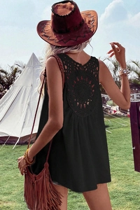 Detailed back view of women's sleeveless top with crochet lace cutout and bohemian style