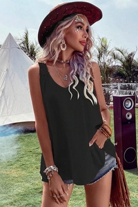 Detail of loose fit black V-neck tank top styled for an outdoor summer music festival