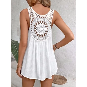 Close-up of bohemian white V-neck top featuring intricate crochet hollow-out back detail