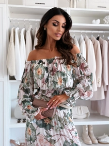 Detail of off-shoulder floral dress featuring pleated texture and elastic cuffs