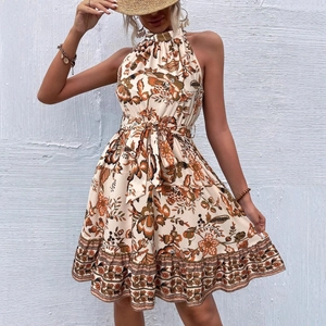 Floral halter neck sleeveless summer dress with waist tie and ruffle hem for a boho look