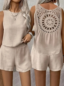 Detail of bohemian hollow crochet pattern on the back of beige sleeveless top and shorts set