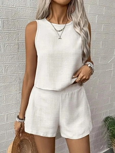 Detail showing the textured fabric of white two-piece sleeveless top and shorts set for women