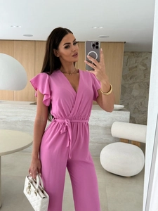 Detail of pink V-neck jumpsuit with ruffled sleeves and elastic tie waist design