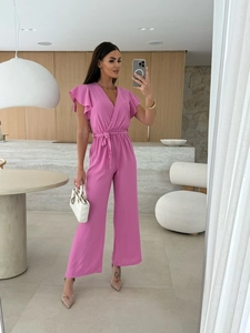 Detail of summer v-neck jumpsuit featuring ruffled sleeves and waist tie in rose pink