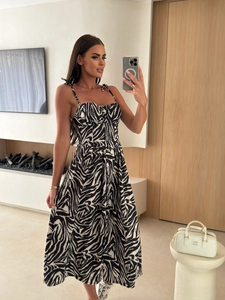 Mirror selfie showing zebra print midi dress with thin straps and button detail