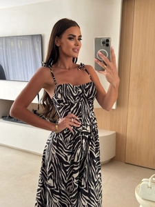 Detail view of summer zebra print dress with bow shoulder straps and button front