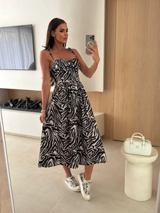 Detail of summer midi dress featuring zebra print, built-in pads and tie-up shoulder straps