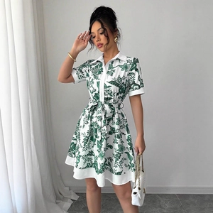 Women's short sleeve shirt dress with green leaf print and waist tie closure