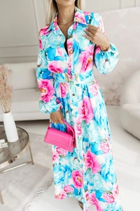 Detail of floral print maxi dress featuring puff sleeves and button-down collar
