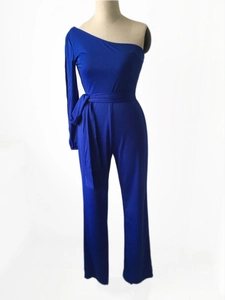 Detail of royal blue one-shoulder jumpsuit with waist tie and wide leg design