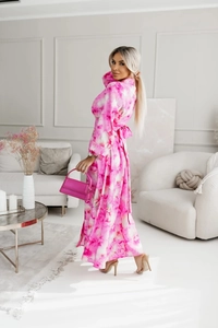 Detailed close-up of pink floral dress with waist tie and delicate long sleeves