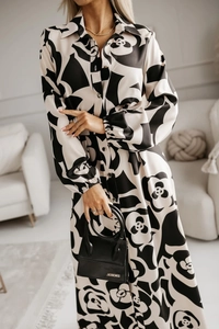 Close-up of black and white abstract floral print chiffon dress with collared button design