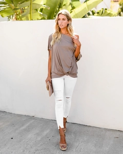 Close-up of the taupe off-shoulder top featuring stylish side-knot draping and pleats