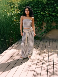 Summer two-piece set featuring a black and white striped tube top and wide-leg trousers