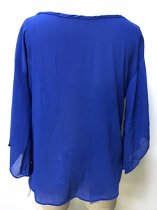 Detail view showing the back of the royal blue chiffon V-neck blouse on a mannequin