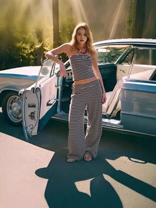 Women's chic black and white striped strapless crop top and wide leg pants set