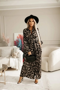 Detail of leopard print shirt dress featuring a classic collar and matching waist belt