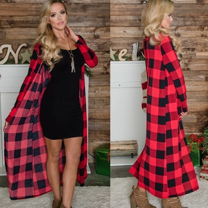 Detailed view of women's long red and black buffalo plaid hooded cardigan with side slit