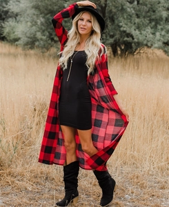 Detailed view of red and black plaid long cardigan with a loose fit and autumn style