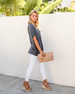 Detail of dark grey off-shoulder T-shirt with side ruching and soft draped texture
