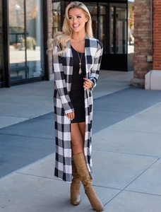 Detail view of long sleeve buffalo plaid cardigan sweater with open front design