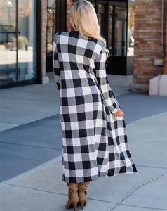 Rear view of long black and white plaid cardigan showing straight cut and elegant drape