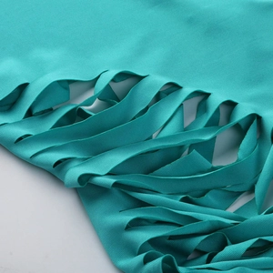 Detailed macro view of teal knit fabric featuring horizontal ladder-cut hollow out design