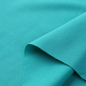 Detailed macro view of the cyan knit fabric showing fine diagonal ribbed texture and material