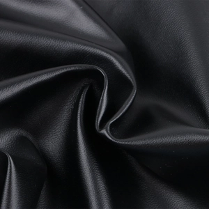Detailed macro view showing the soft matte lychee texture of the black faux leather fabric