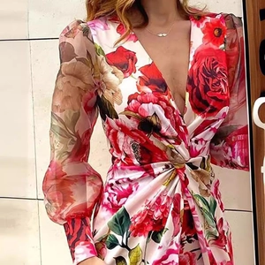 Floral print midi dress with deep V-neck, mesh sleeves, and twisted waist detailing