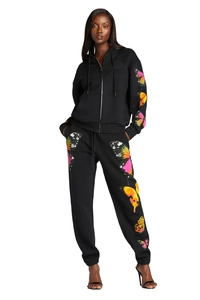 Detail of colorful butterfly prints on black drawstring hoodie and jogger pants set