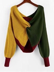 Detail of twisted front knit sweater with contrast blocking in mustard, green and burgundy