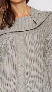 Detail of light grey cable knit texture and large fold-over collar on winter dress