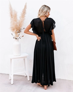 Detail of the back cutout with tie-up design on this elegant black ruffled maxi dress