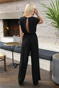 Detail view of the back design on a black V-neck jumpsuit with button closure