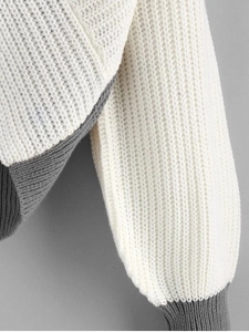 Detailed macro view of the two-tone chunky knit texture on this ribbed women sweater