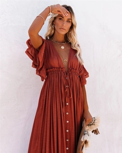 Detail view of V-neckline with ruffle sleeves and button-down front on boho maxi dress
