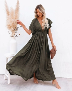 Detail of V-neck maxi dress featuring ruffled sleeves and dark olive linen texture