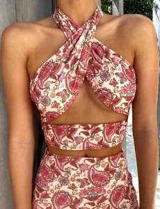 Detail of paisley print halter top and ruched skirt set in pink and purple tones