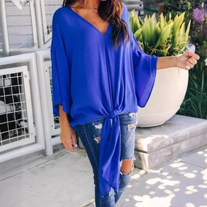 Royal blue V-neck chiffon blouse with flutter sleeves and a stylish front tie knot detail